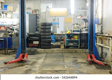 Empty Workshop With A Lift In A Car Repair Station