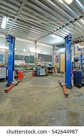 Empty Workshop With A Lift In A Car Repair Station