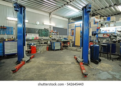 Empty Workshop With A Lift In A Car Repair Station