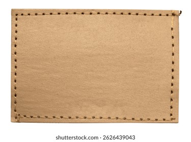 Empty worn leather patch on blue jeans on a white background. Empty space for writing. Blank leather jeans label