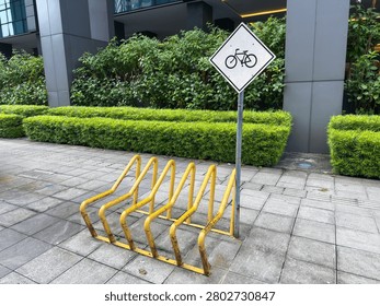 Empty Yellow Bicycle Rack with Cycle Sign Urban Building No People