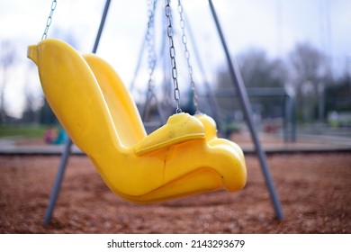 Empty Yellow Child Swing Set