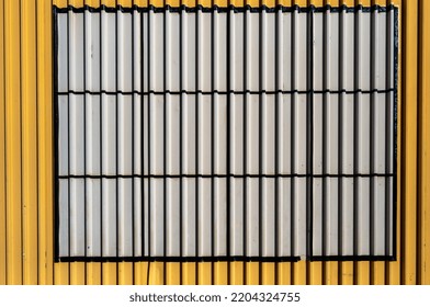 Empty Yellow, Gray And Black Corrugated Metal Backdrop.