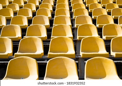 Empty Yellow Seats On Outdoor Sport Stadium Arena For Football Fans, Big Game.