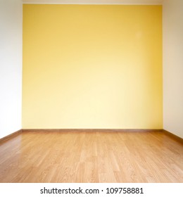 Empty Yellow Wall And Wooden Floor Room