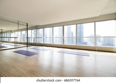 Empty yoga studio and cityscape
