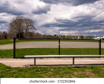 Empty youth baseball field bench
