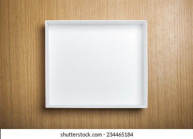 A Empty(blank) White Box On The Desk(table) Top View At The Studio.