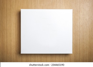 A Empty(blank) White Box On The Desk(table) Top View At The Studio.