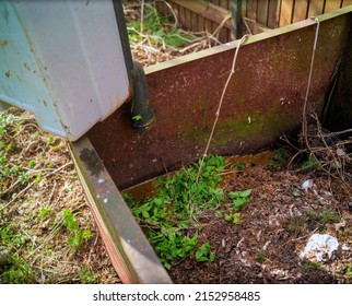 Emptying A Portable Potty Into A Compost Box, Sunny Day Shot