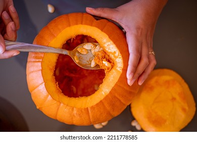 Emptying the pumpkin pulp for halloween. Top view - Powered by Shutterstock