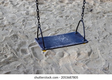 Empty,no People, Swing Holded By Chains On Sands Background.
Abandoned,left Swing In Public Park