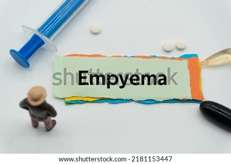 Empyema.The word is written on a slip of colored paper. health terms, health care words, medical terminology. wellness Buzzwords. disease acronyms.