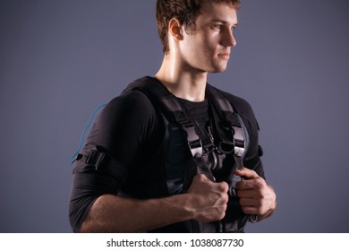 EMS, Portrait Of Handsome Man Near Electro Muscle Stimulation Machine