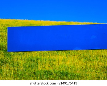 Emtpy blue Sign in Front of Landscape