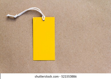 Emtry Yellow Price Tag On Brown Paper Background
