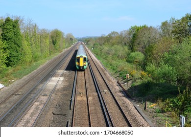 An EMU Train Leaving Horley Station In Surrey.