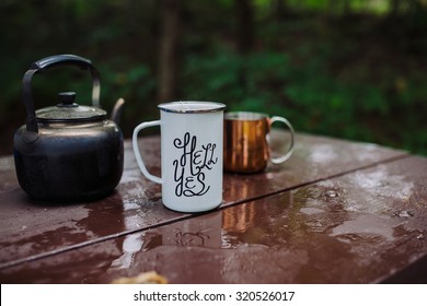 Enamel Mug With A Hell Yes Sign On It In The Outdoors Setting