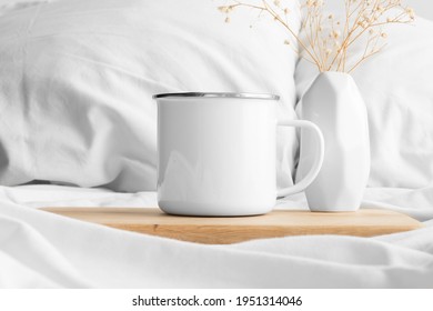 Enamel Mug Mockup And A Gypsophila On The Bed.