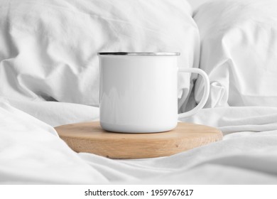 Enamel Mug Mockup On The Bed.