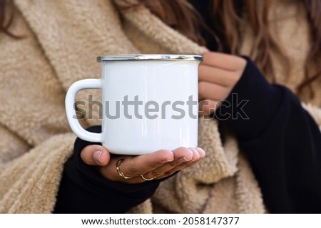 Enamel White Mug with Gray Borderline Mock-up. Girl in camping clothes holding white old tin campfire cup. Camping mug mock up.