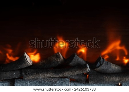 Enchanting embers of firewood aflame engulfed in dancing flames radiating a warm cozy glow that captures the essence of a tranquil rustic ambiance for luxury home decor in the living room