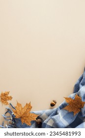 Enchanting fall aesthetic concept. Top view vertical arrangement of warm blanket, acorns, autumn maple leaves on pastel beige background with empty space for promo or message - Shutterstock ID 2345481993