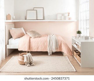 Enchanting Girl's Bedroom, Pink Single Bed Adorned with a Quilted Bedspread, Comfy Ivory Knit Throw, Fluffy Cushion, Woven Tassel Basket, on a Pattern Rug, Under a White Minimalist Shelf, Chic Decor. - Powered by Shutterstock