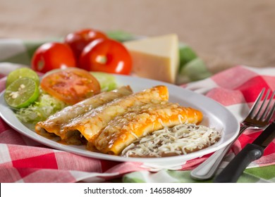 Enchilada Plate With Refried Beans And Side Of Salad