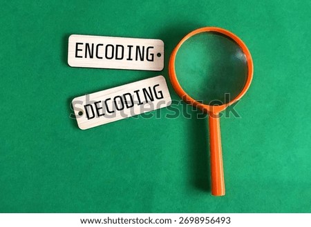 Encoding and decoding words on square wooden pieces with magnifying glass
