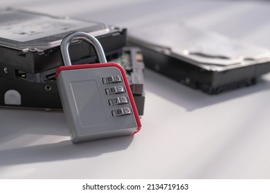 Encrypted hard disk. Padlock with cipher on an opened hard disk. Data loss. computer motherboard. the concept of data, hardware, information technology and cyber security.