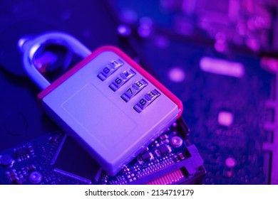 Encrypted hard disk. Padlock with cipher on an opened hard disk. Data loss. computer motherboard. the concept of data, hardware, information technology and cyber security.