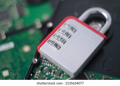 Encrypted hard disk. Padlock with cipher on an opened hard disk. Data loss. computer motherboard. the concept of data, hardware, information technology and cyber security.
