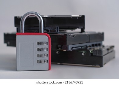 Encrypted Hard Disk. Padlock With Cipher On An Opened Hard Disk. Data Loss. Computer Motherboard. The Concept Of Data, Hardware, Information Technology And Cyber Security.