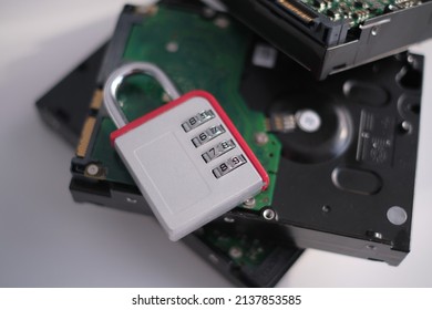 Encrypted hard disk. Padlock with cipher on an opened hard disk. Data loss. computer motherboard. the concept of data, hardware, information technology and cyber security.