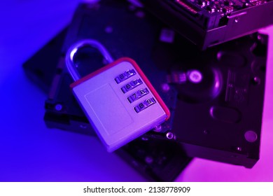 Encrypted hard disk. Padlock with cipher on an opened hard disk. Data loss. computer motherboard. the concept of data, hardware, information technology and cyber security.