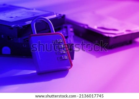 Encrypted hard disk. Padlock with cipher on an opened hard disk. Data loss. computer motherboard. the concept of data, hardware, information technology and cyber security.