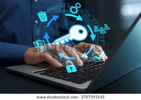 Encryption key management system and lifecycle. Secure key exchange and generation. Businessperson using laptop computer for cryptographic operations.