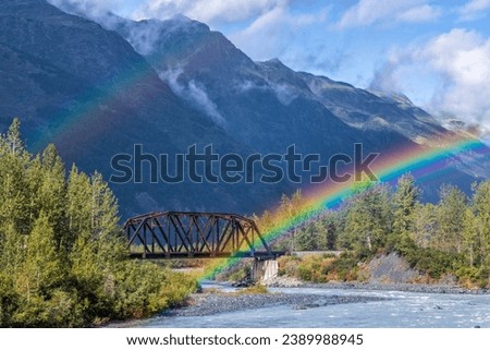 The end (or beginning) of a double rainbow on an Alaska Railroad bridge over the Placer River near Spencer Glacier in Chugach National Forest, Alaska.