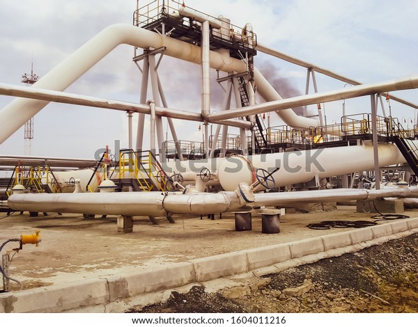The end phase divider is tubular.\
Equipment for separating water from oil. Oil field. The equipment\
of crafts in Western Siberia, iron designs and\
pipes