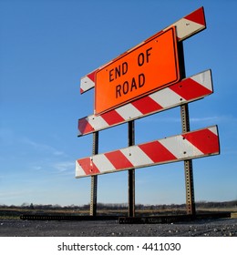 End Of The Road Sign Against Blue Sky