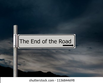 The end of the road, sign over dark, gloomhy cloud sky background. Concept, politics,, Brexit etc.