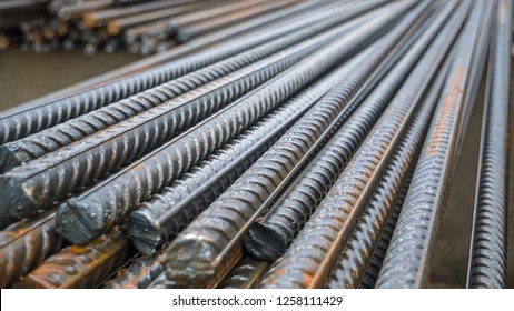 End Of Rustic Of Steel Bar At The Construction Site. Rustic Metal Armature Rod. Building Construction Background