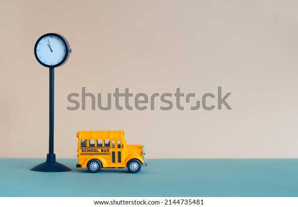 End of\
School year or Last Day of School concept. Toy school bus and\
mechanical watch on a stand, place for text. First Day of School,\
National Teacher Day, Teacher Appreciation\
Week.