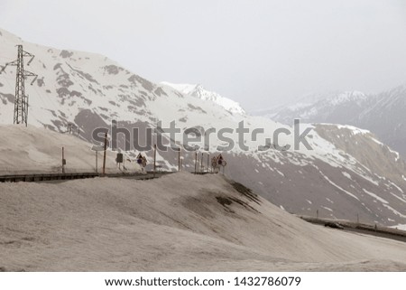 Similar – Image, Stock Photo Ski area with snow-covered mountains in the background