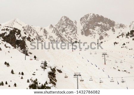 Similar – Image, Stock Photo Ski area with snow-covered mountains in the background