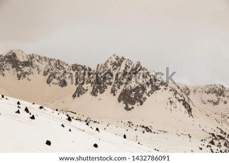 Similar – Image, Stock Photo Ski area with snow-covered mountains in the background