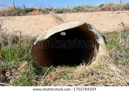 End view of Small culvert under a farm to market road in Texas