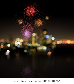 End Of Year 2021 Concept: Beautiful Firework On Blurred City Night Background. Bangkok, Thailand, Asia