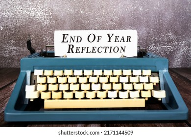 End Of Year Reflection Words Typed On An Old Typewriter. Retro Style. New Year Resolution Concept.